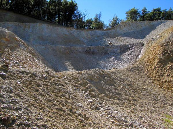 The large open-cast pit produces an extract high in quartz