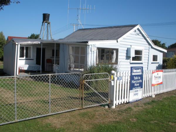 Milford Huts at the Opihi River mouth, this one sold between $60-70k, with long drop