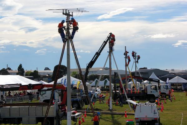 Pole top fit out of assembly’s onto the concrete poles.The team in the foreground (WEL) were the eventual winners.